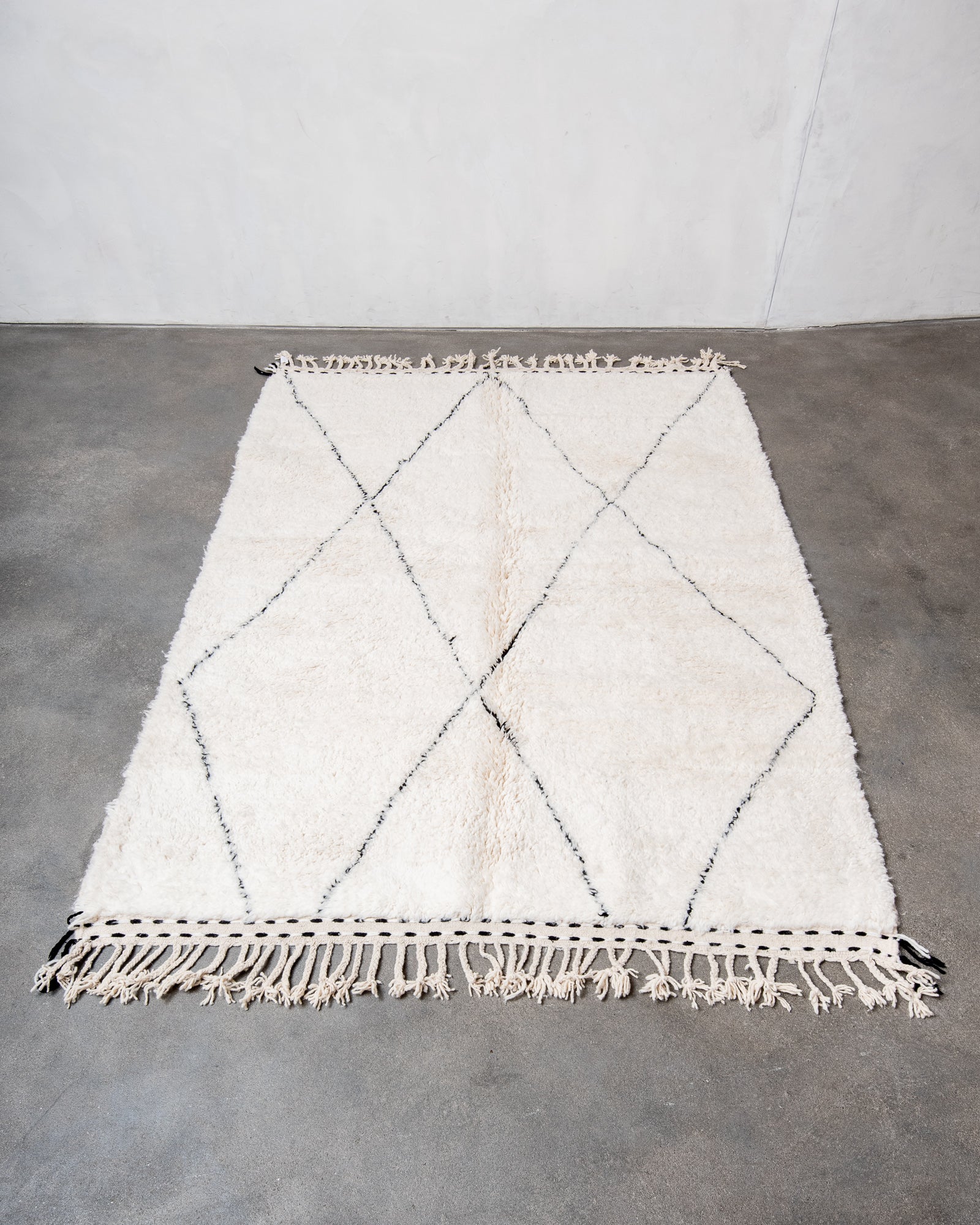 Modern, designer, handcrafted Berber rug from Morocco. Beniourain carpet with beautiful colours and patterns and fluffy wool texture.
